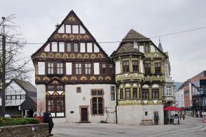 an old building with a turreted building on a street at Haus unterm Räuschenberg in Höxter