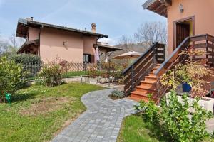 a house with a walkway leading to a house at Intelvi House in Castiglione dʼIntelvi