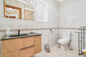 a bathroom with a sink and a toilet at Casa Ramos Con Jacuzzi in Nerja +23 photos