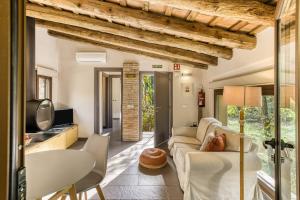 a living room with a couch and a table at La Pallissa - Can Bonet in Sant Martí Vell