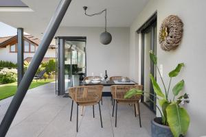 a dining room with a table and chairs at New Opening Vinea Guesthouse in Cornedo all'Isarco