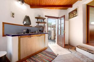 a kitchen with a sink and a counter top at Yukalele 2 in Lajares +15 photos