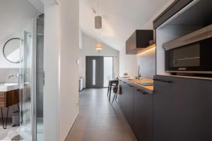 a kitchen with a sink and a counter at Ferienwohnung 6 in Bad Ditzenbach