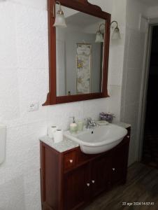 a bathroom with a sink and a mirror at La Vista Sul Castello in Compiano +35 photos