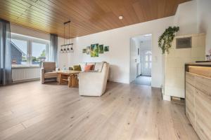 a living room with a couch and a table at Ferienhaus Inge in Oldenburg