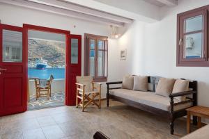 a living room with a couch and a table at Nicolas House 2 in Rakhídhion