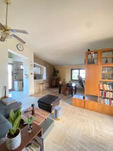 a living room with a couch and a table at Dall'alba al Tramonto in Alezio