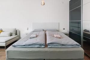 a bedroom with a bed with towels on it at Ferienwohnung Sally in Lenzkirch +17 photos