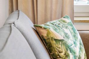 a pillow sitting on top of a couch at Waldmariechen in Neresheim