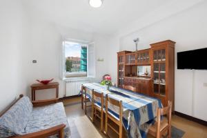 a kitchen and dining room with a table and chairs at Dai Baccino in Celle Ligure