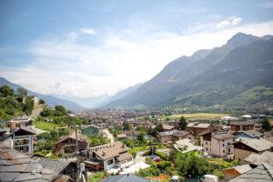 a town in a valley with mountains in the background at La Maison De Carletto in Sarre