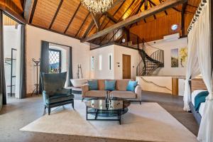 a living room with a couch and a table at Thanhammer Apt Quarz in Terlano +23 photos