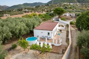 an aerial view of a house with a swimming pool at La Casita del Limoncito in Alcaucín