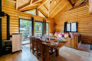 a wooden dining room with a table and chairs at Chalet Agréable 3 étoiles app 4 in Courchevel
