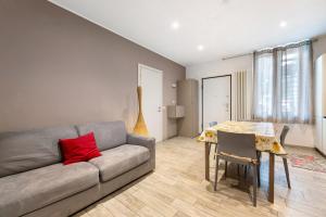 a living room with a couch and a table at La Casa Di Beppe - Val d'Intelvi in Lanzo dʼIntelvi +13 photos