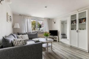 a living room with a couch and a table at Ferienhaus Nilsson in Heide