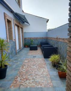 a patio with potted plants on the side of a building at Casa Pablo Picasso 9 in Jimena de la Frontera