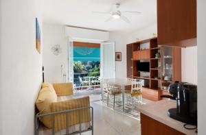 a living room with a couch and a table at Il Corallo in Albisola Superiore