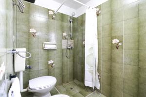 a bathroom with a toilet and a shower at Casa Isabel a Otranto 10 posti in Otranto +15 photos