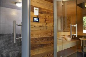 a wooden door in a bathroom with a shower at Kuckucks Hideaway in Oberibach +32 photos
