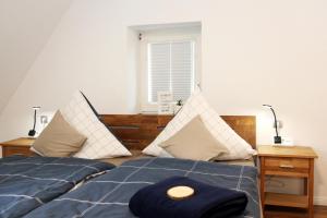 a bedroom with two beds and a window at Ferienwohnung Blum in Schmallenberg