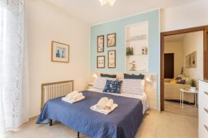 a bedroom with a bed with towels on it at La Terrazza in Brunate