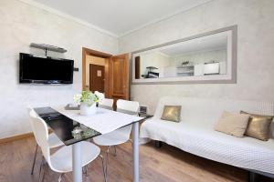 a living room with a couch and a table at Il ponte dei sogni in Brescia