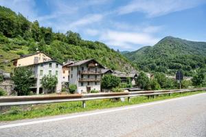 a town on the side of a road with mountains at Casa Giulia Balmuccia in Balmuccia