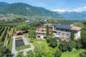 an aerial view of a house with a solar roof at Weinsepphof Ferienwohnung 3 in Lana