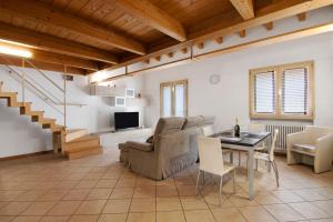 a living room with a couch and a table at Casa Zia Dani in Piantedo
