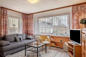 a living room with a couch and a table at Haus Marianne Duffner in Schonach