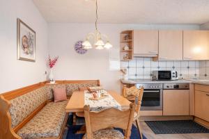 a living room with a couch and a table at Haus Marianne Duffner in Schonach