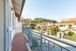 a balcony with a view of a city at Holiday House Giuliana in Poggio a Caiano