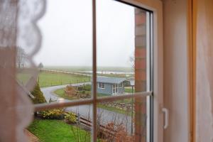 a view of a house from a window at Ferienwohnung Abendsonne in Lehe
