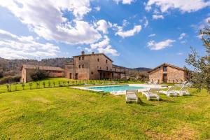 an estate with a swimming pool and a building at Agriturismo la Taverna Di Celsa in Sovicille