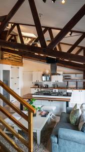 a living room with a couch and a table at The Lofts Boutique Hotel in Knysna