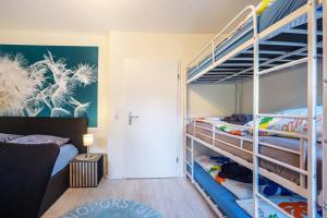 a bedroom with two bunk beds and a doorway at Ferienhaus Sandstrand in Timmendorfer Strand