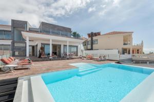 a pool in the backyard of a house at Stunning Casa Bella Vista in Adeje