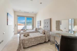 a large living room with a couch and a table at Stunning Casa Bella Vista in Adeje +35 photos