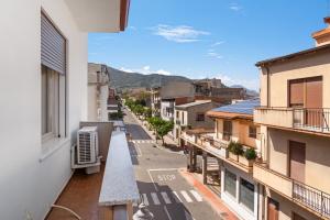 a view of a city street from a balcony at 4 Seasons Apartment in Guspini