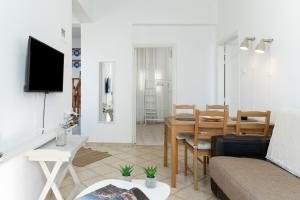 a living room with a couch and a table at Olympos Blue in Karpathos