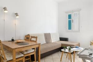 a living room with a couch and a table at Olympos Blue in Karpathos