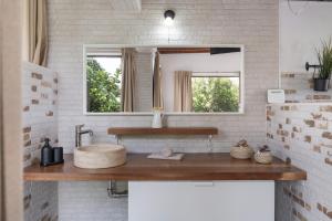a bathroom with a sink and a mirror at Guenia ll in El Mojón +13 photos