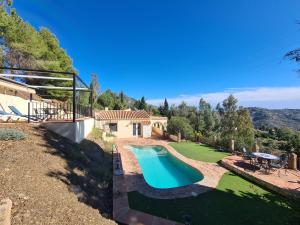 an image of a swimming pool in a yard at Casa tranquila torrox in Cómpeta
