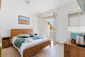 a bedroom with a bed and a balcony at Andromeda's Rooms in Otranto