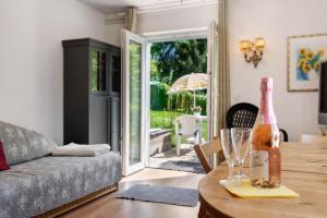a living room with a bottle of wine on a table at Ferienwohnung Zizi in Stockach