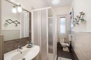 a bathroom with a shower and a sink and a toilet at Alassio Mare E Non Solo 2 in Alassio +17 photos