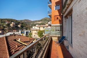 a balcony with a view of a city at Alassio Mare E Non Solo 2 in Alassio