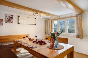 a dining room with a table with wine glasses at Alte Schmiede in Feldberg