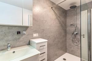 a bathroom with a sink and a shower at Ferienwohnung Eulennest in Schramberg +24 photos
